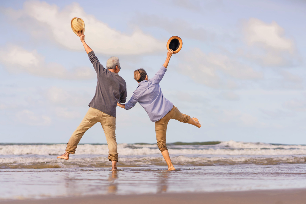 asian senior couple jumping beach elderly honeymoon together very happiness after retirement plan life insurance activity after retirement summertime Couple de retraité