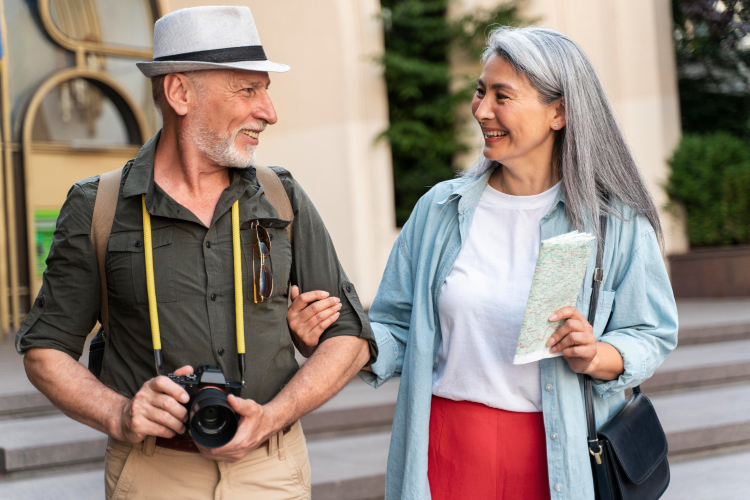 medium shot senior couple with map